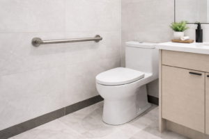 bathroom grab bar installed on tiled wall for support